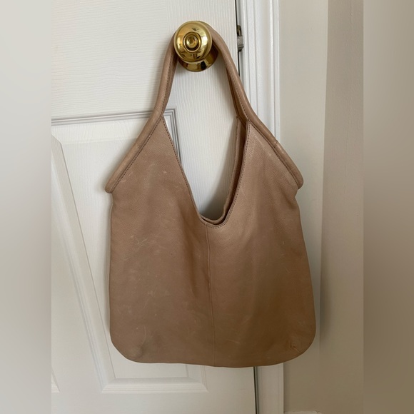 Anthropologie shoulder bag. Distressed vegan leather in a light taupe color. - Picture 1 of 4